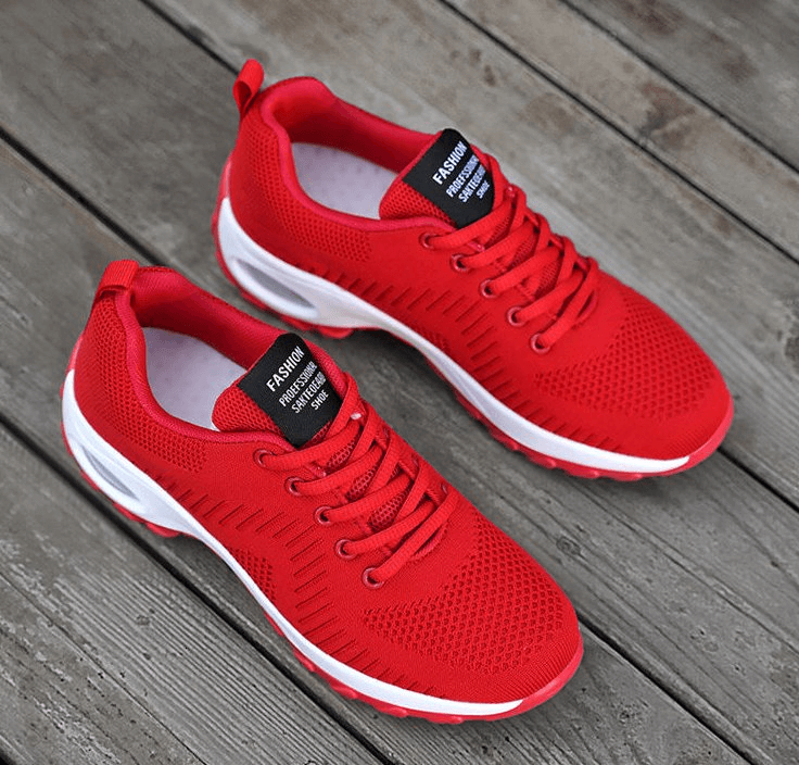 Red stylish breathable women's sneakers with mesh air upper and non-slip sole, perfect for sports and outdoor activities.
